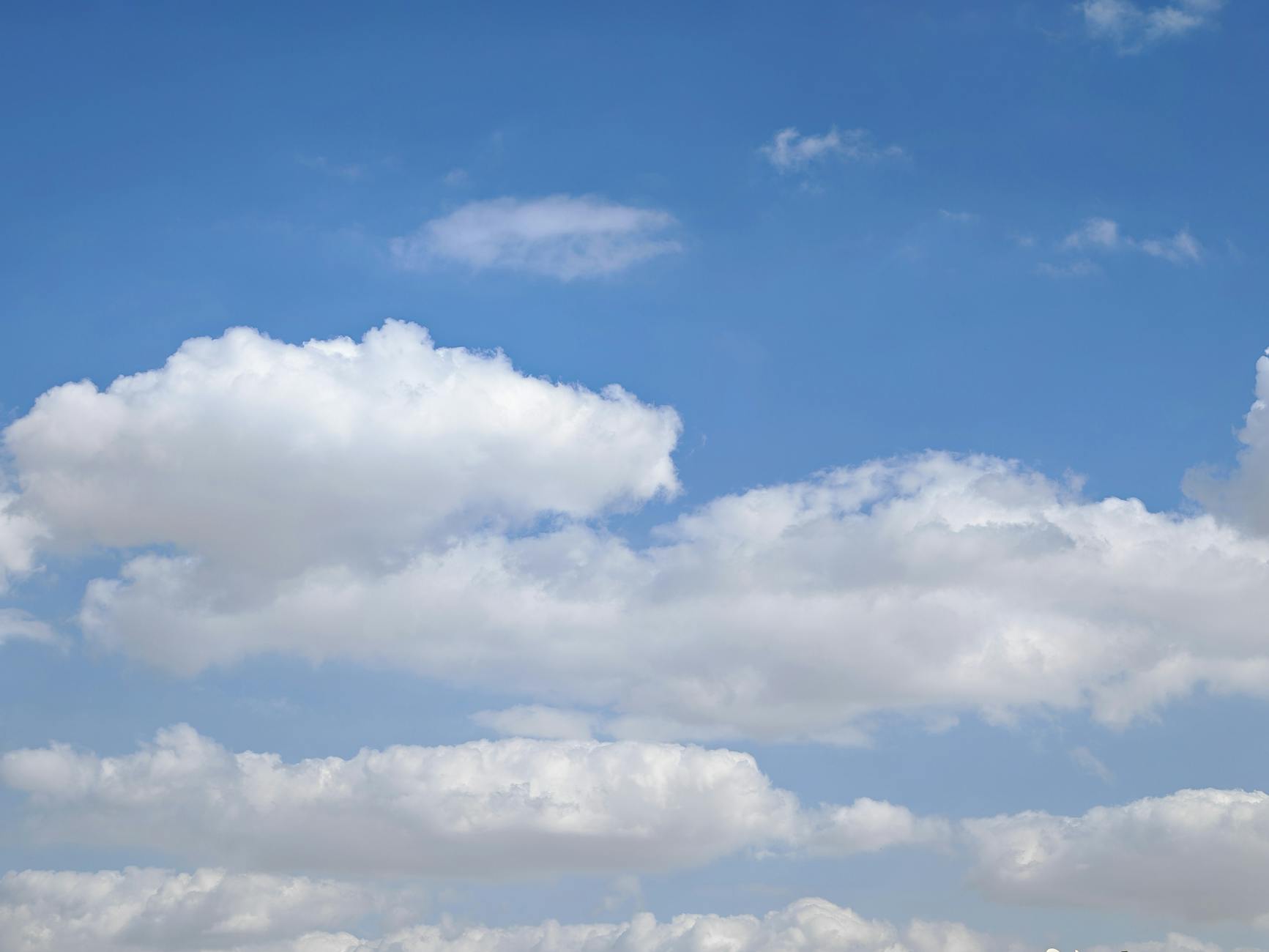 bright blue sky with fluffy clouds