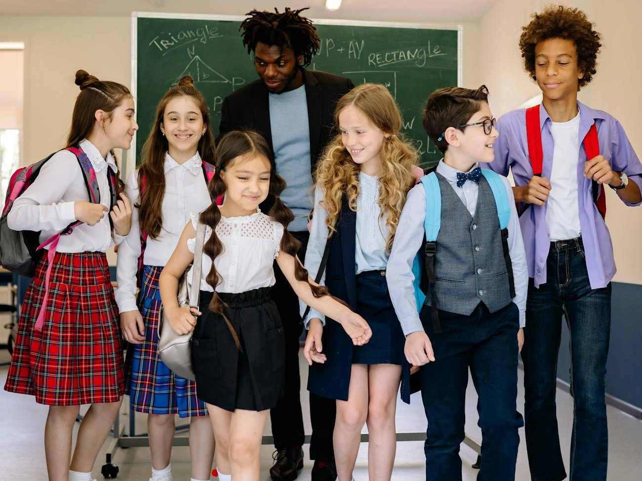 children walking at the school with their teacher